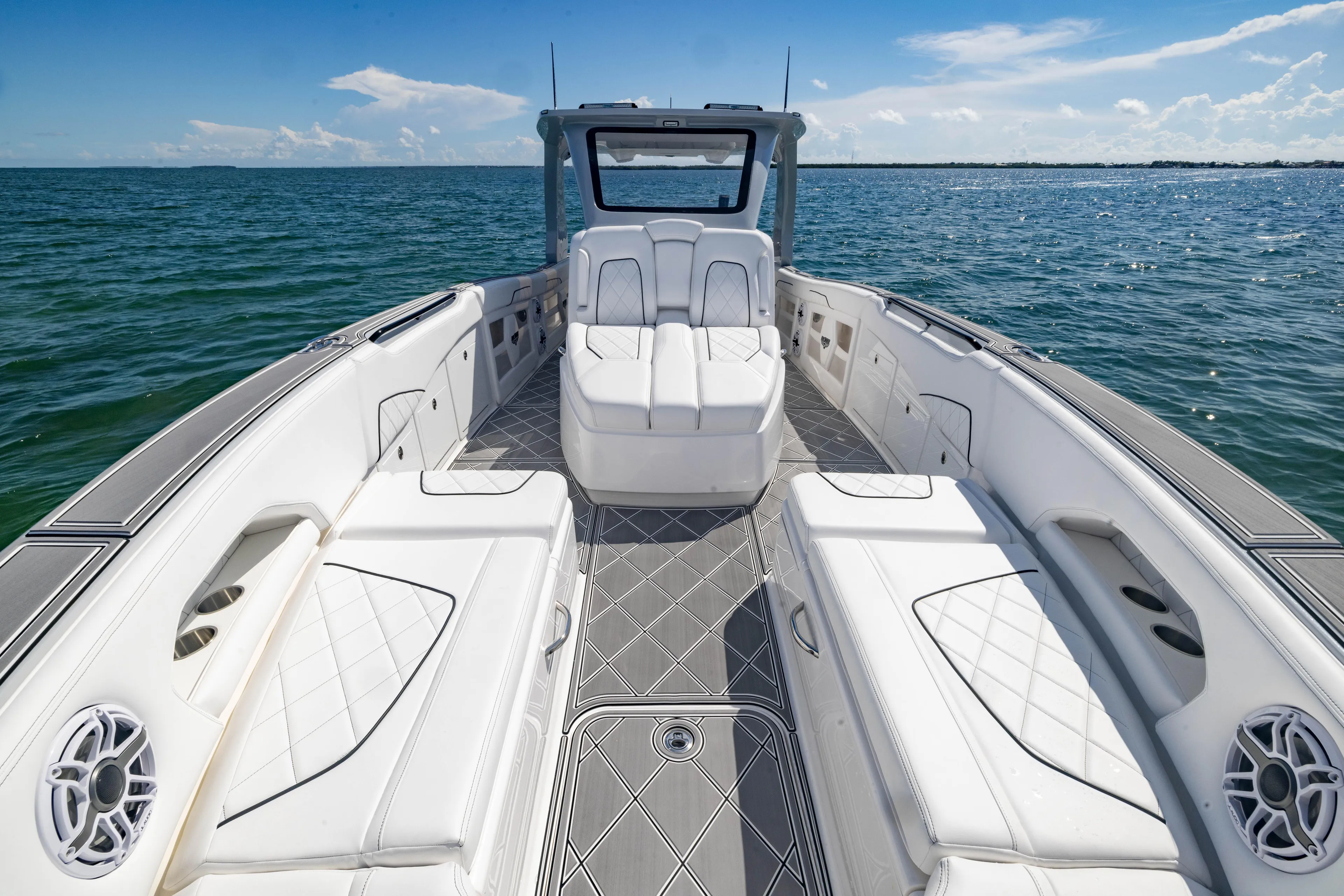  Yacht Photos Pics 2024 Deep Impact 399 Sport boat interior with luxurious seating on open water.