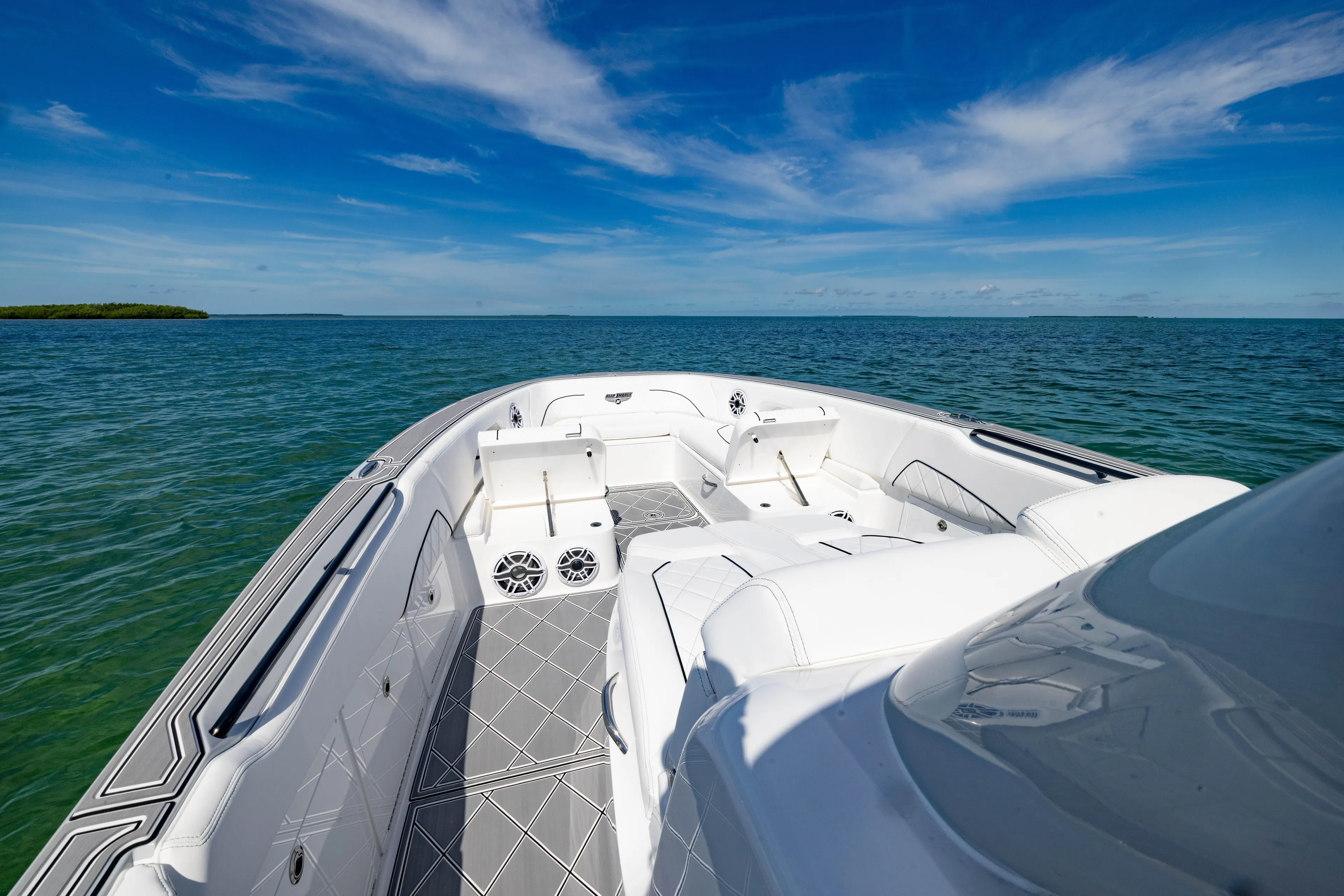  Yacht Photos Pics 2024 Deep Impact 399 Sport boat on open water under clear blue sky.
