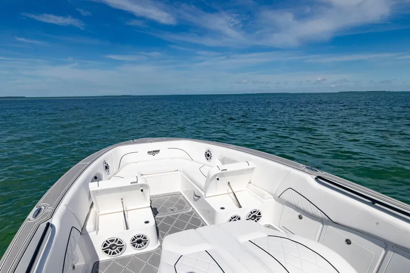  Yacht Photos Pics 2024 Deep Impact 399 Sport boat on open water under clear blue sky.