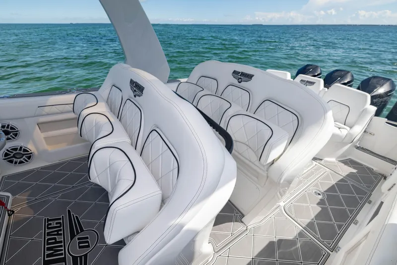  Yacht Photos Pics 2024 Deep Impact 399 Sport boat interior with luxurious seating and ocean view.