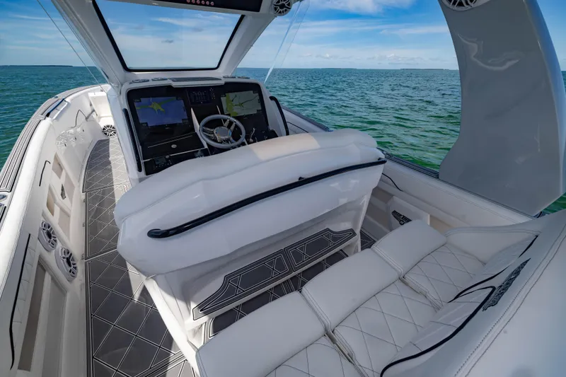  Yacht Photos Pics 2024 Deep Impact 399 Sport boat interior with luxurious seating and advanced navigation system.