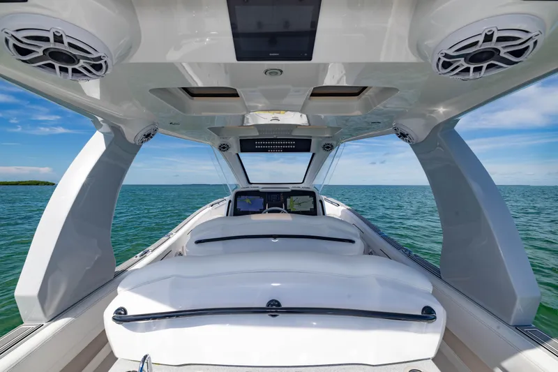  Yacht Photos Pics 2024 Deep Impact 399 Sport boat interior with sleek design on open water.