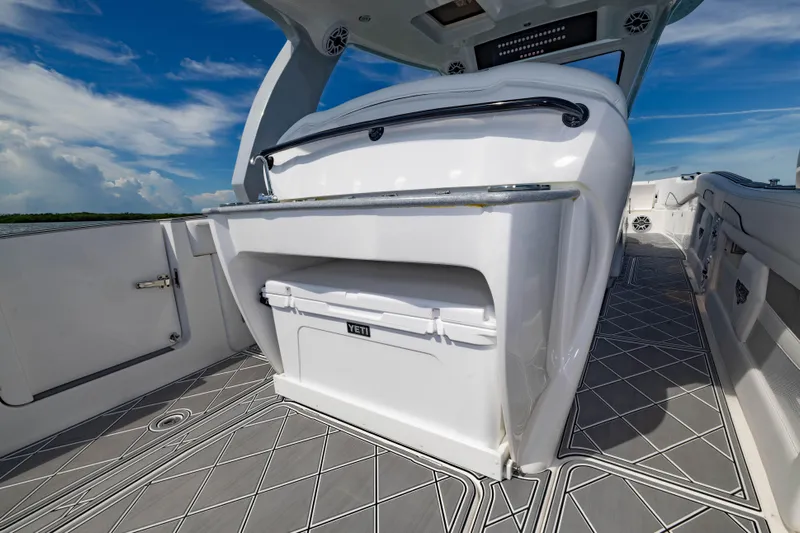  Yacht Photos Pics 2024 Deep Impact 399 Sport boat interior with Yeti cooler and sleek design.