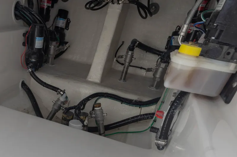  Yacht Photos Pics Engine compartment of 2024 Deep Impact 399 Sport boat, showcasing intricate wiring and components.
