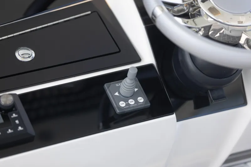  Yacht Photos Pics 2024 Deep Impact 399 Sport boat dashboard with joystick control and steering wheel.