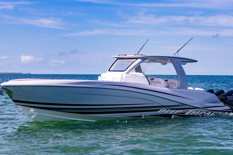  Yacht Photos Pics 2024 Deep Impact 399 Sport boat on calm ocean waters under clear blue sky.