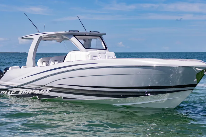  Yacht Photos Pics 2024 Deep Impact 399 Sport boat on calm ocean waters under clear blue sky.