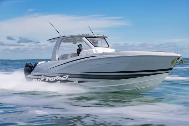  Yacht Photos Pics 2024 Deep Impact 399 Sport boat cruising on open water, showcasing sleek design and performance.