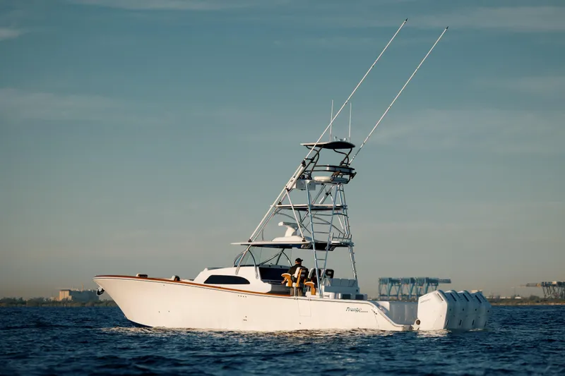  Yacht Photos Pics 2026 Front Runner 47 Center Console boat on open water, featuring multiple outboard engines.