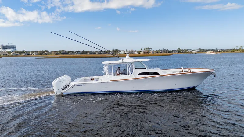  Yacht Photos Pics 2026 Front Runner 47 Center Console boat cruising on a calm river.