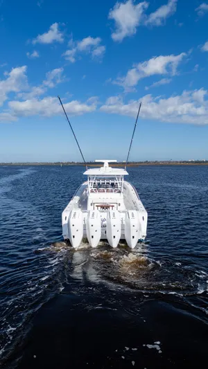  Yacht Photos Pics 2026 Front Runner 47 Center Console boat cruising on open water under blue sky.