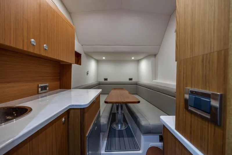  Yacht Photos Pics Luxurious interior of 2026 Front Runner 47 Center Console boat with modern seating and wood finishes.
