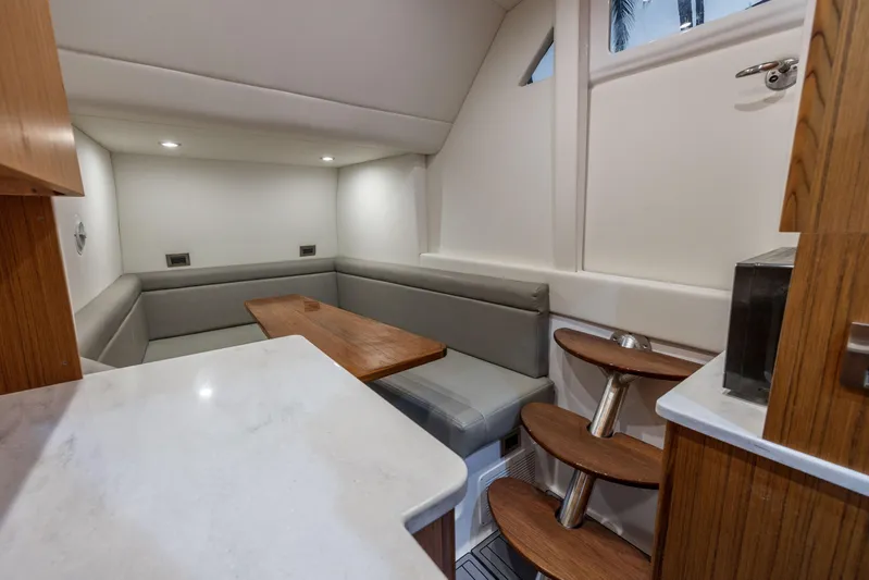  Yacht Photos Pics Luxurious interior of 2026 Front Runner 47 Center Console with modern seating and wooden accents.