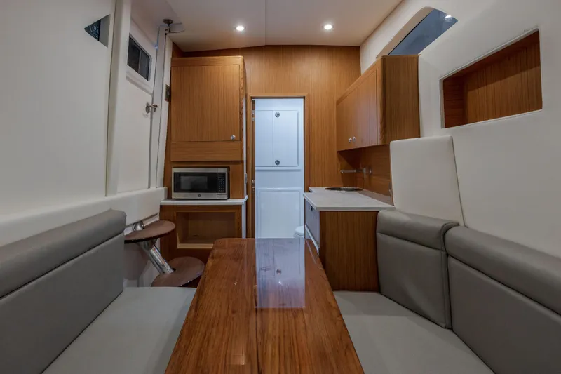  Yacht Photos Pics Interior of 2026 Front Runner 47 Center Console with modern kitchen and seating area.