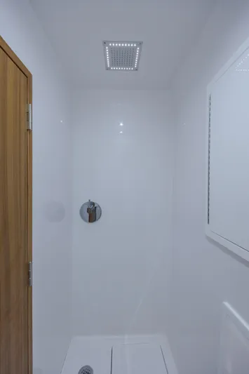  Yacht Photos Pics Shower area in 2026 Front Runner 47 Center Console boat, featuring modern fixtures.