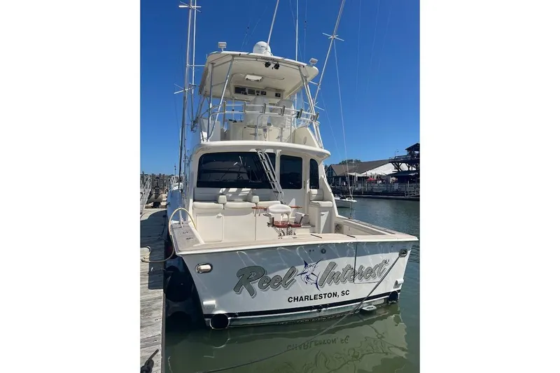 Reel Interest Yacht Photos Pics 2002 Ocean Yachts 56 Super Sport docked in Charleston, SC, rear view.