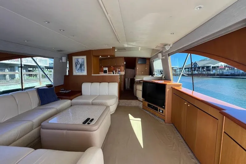 Reel Interest Yacht Photos Pics Luxurious interior of 2002 Ocean Yachts 56 Super Sport with elegant seating and waterfront views.