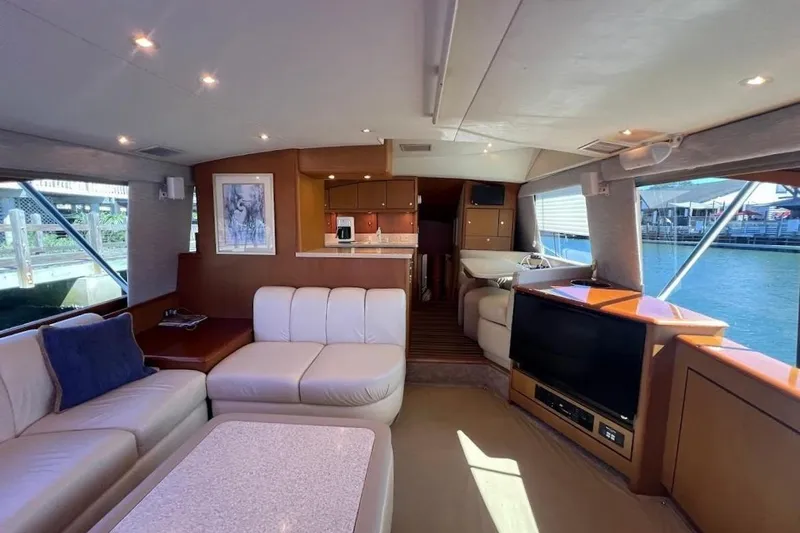 Reel Interest Yacht Photos Pics Luxurious interior of a 2002 Ocean Yachts 56 Super Sport with elegant seating and modern amenities.