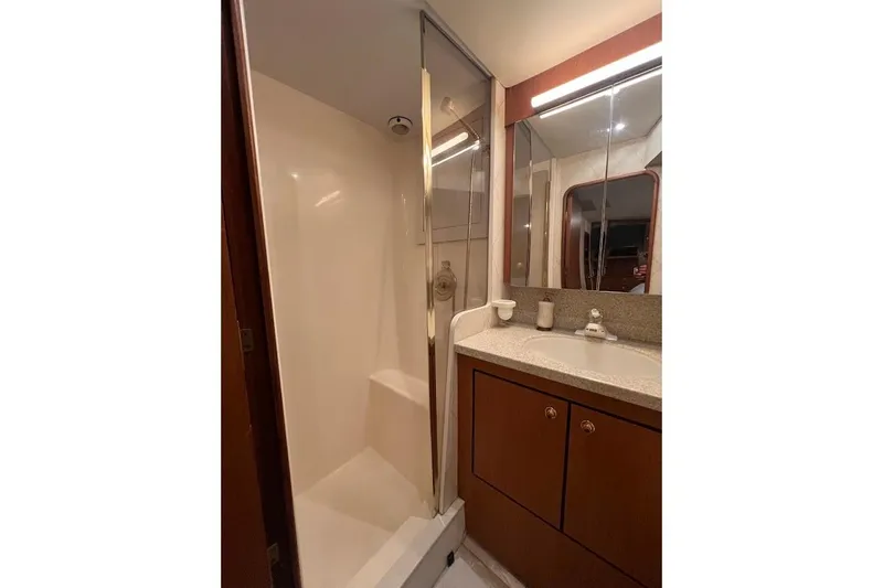 Reel Interest Yacht Photos Pics Bathroom interior of 2002 Ocean Yachts 56 Super Sport with shower and vanity.
