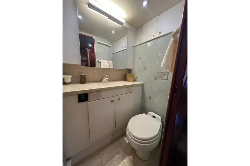 Reel Interest Yacht Photos Pics Bathroom interior of 2002 Ocean Yachts 56 Super Sport with modern fixtures.