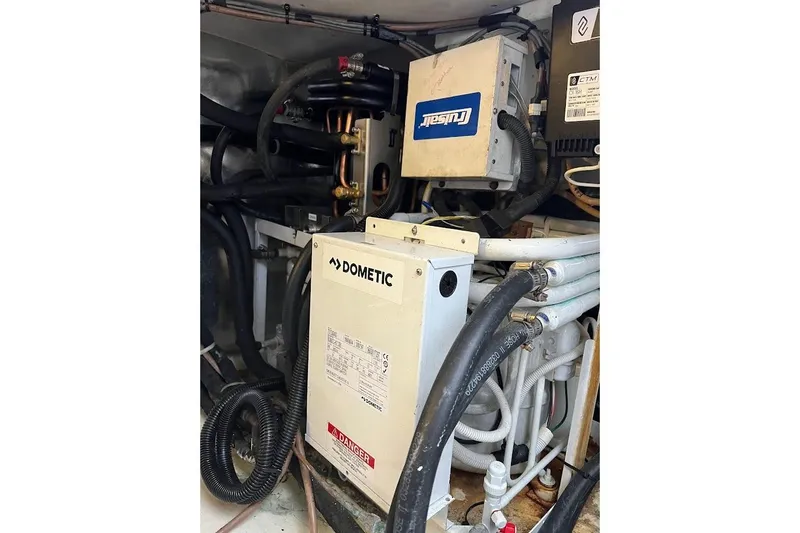 Reel Interest Yacht Photos Pics Engine room of 2002 Ocean Yachts 56 Super Sport with Dometic equipment and wiring.