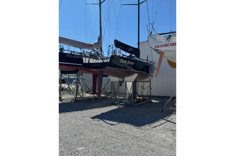 Dark Storm Yacht Photos Pics 2019 J Boats J/121 sailboat "Dark Storm" on stands, surrounded by other boats.