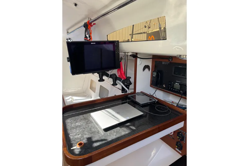 Dark Storm Yacht Photos Pics 2019 J Boats J/121 navigation station with electronics and laptop setup.