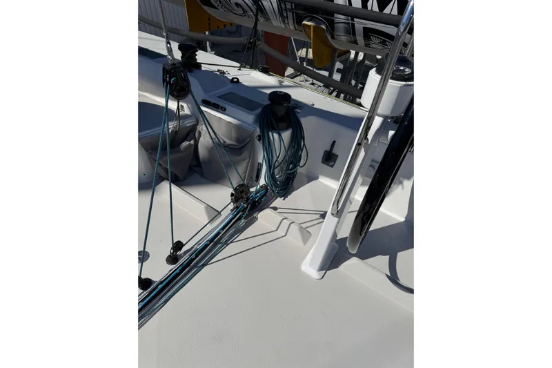 Dark Storm Yacht Photos Pics 2019 J Boats J/121 sailboat deck with rigging and steering wheel.