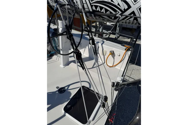 Dark Storm Yacht Photos Pics 2019 J Boats J/121 sailboat cockpit with steering wheel and rigging details.