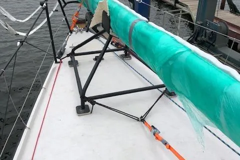 Dark Storm Yacht Photos Pics 2019 J Boats J/121 sailboat deck with wrapped mast and rigging.