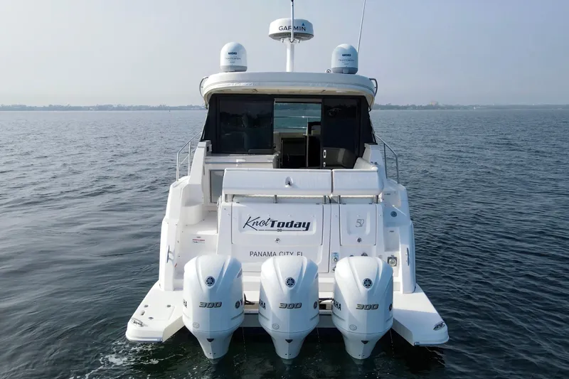  Yacht Photos Pics 2020 Regal 38 XO yacht with triple Yamaha engines on open water.