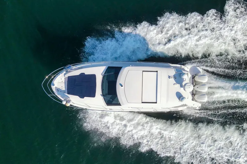  Yacht Photos Pics Aerial view of 2020 Regal 38 XO yacht cruising on open water.