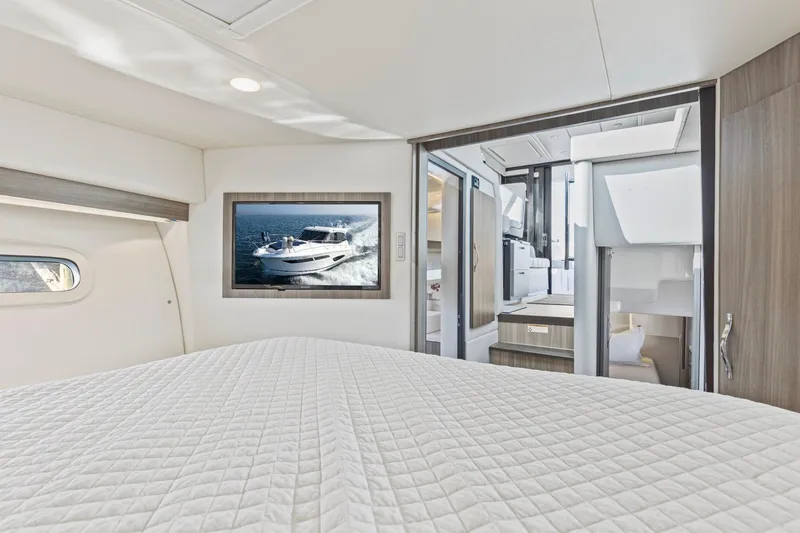  Yacht Photos Pics Luxurious interior of 2020 Regal 38 XO yacht with modern design and comfortable bedding.