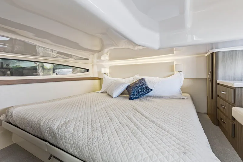  Yacht Photos Pics Luxurious cabin interior of 2020 Regal 38 XO yacht with cozy bed and modern design.