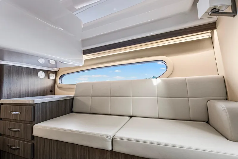  Yacht Photos Pics Luxurious interior of 2020 Regal 38 XO yacht with modern seating and cabinetry.