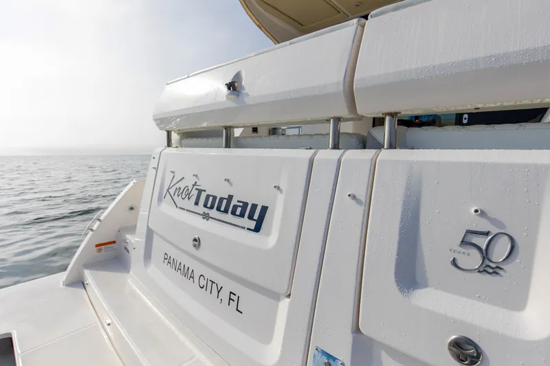  Yacht Photos Pics 2020 Regal 38 XO boat with "Knot Today" name, Panama City, FL, on calm water.