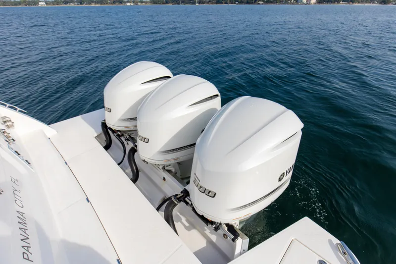  Yacht Photos Pics 2020 Regal 38 XO boat with triple Yamaha outboard engines on open water.