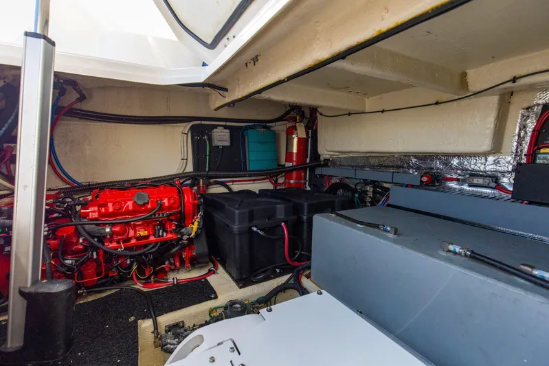  Yacht Photos Pics Engine room of 2020 Regal 38 XO boat with visible red engine components.
