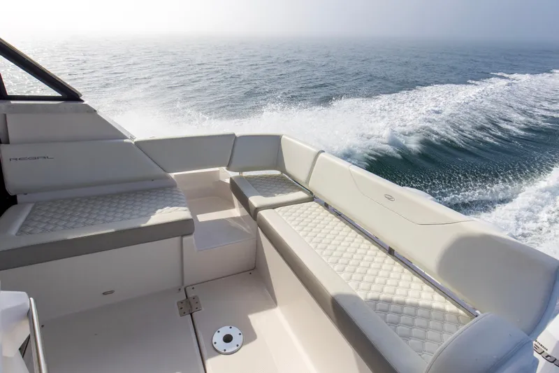  Yacht Photos Pics 2020 Regal 38 XO boat interior with white seating, ocean view, and wake.