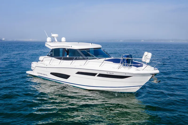  Yacht Photos Pics 2020 Regal 38 XO yacht cruising on open water under clear skies.