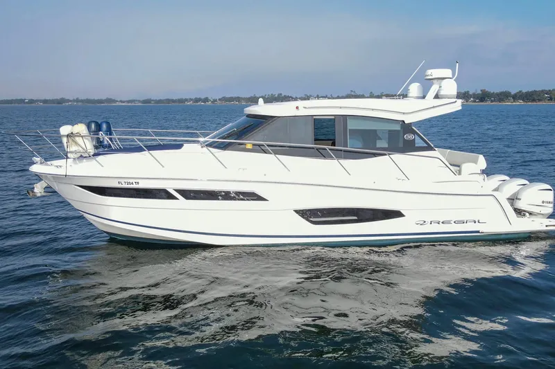  Yacht Photos Pics 2020 Regal 38 XO yacht cruising on open water, side view.