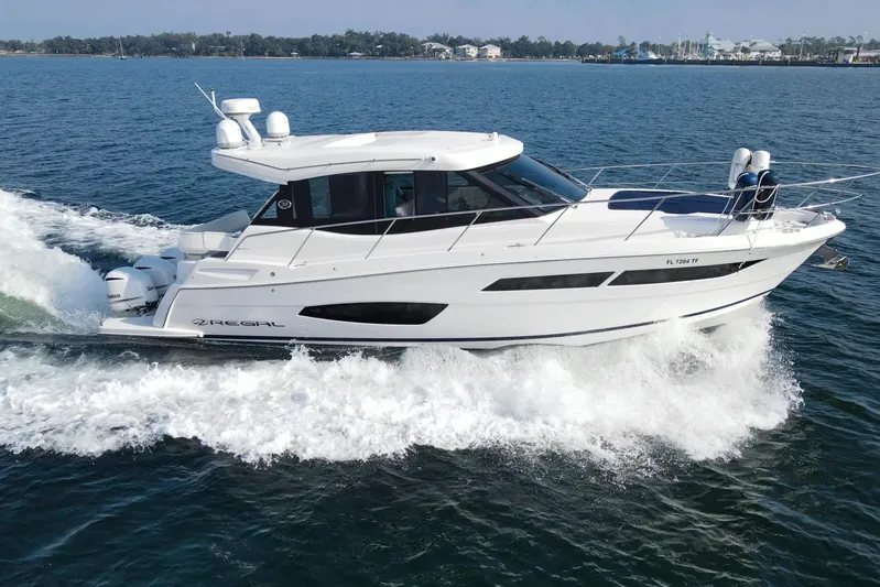  Yacht Photos Pics 2020 Regal 38 XO yacht cruising on open water, showcasing sleek design and powerful performance.