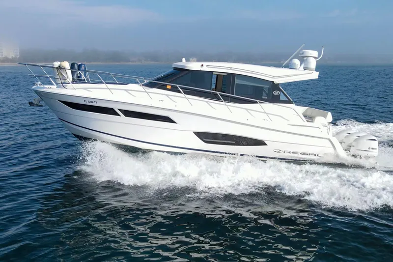  Yacht Photos Pics 2020 Regal 38 XO yacht cruising on open water, showcasing sleek design and powerful performance.