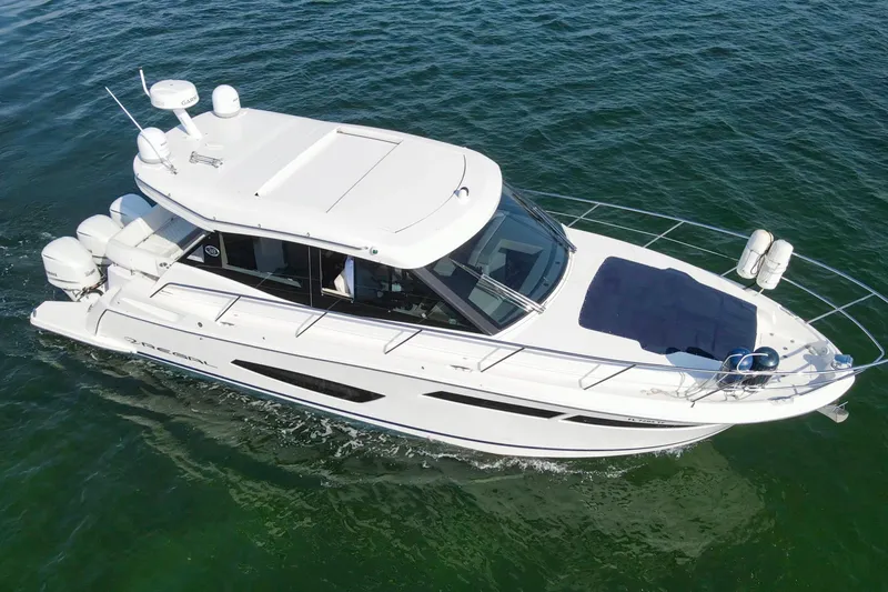  Yacht Photos Pics 2020 Regal 38 XO boat cruising on open water, aerial view.