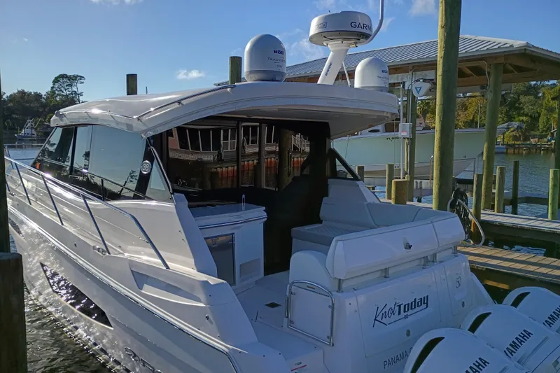  Yacht Photos Pics 2020 Regal 38 XO yacht docked, featuring sleek design and Yamaha engines.