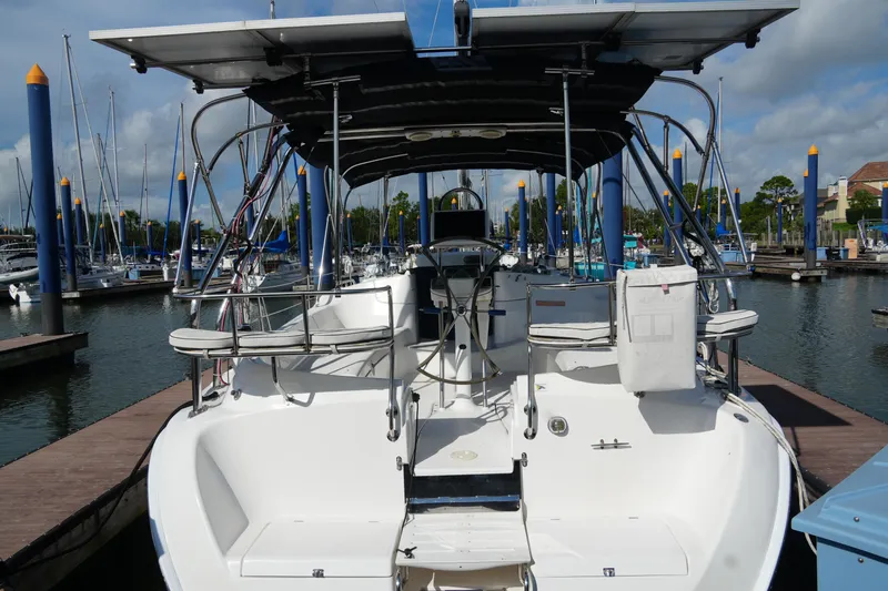 Marabelle Yacht Photos Pics 2005 Hunter 41 AC sailboat docked at marina, featuring spacious cockpit and solar panels.