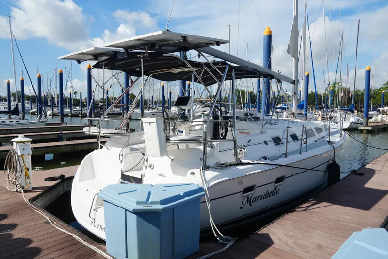 Marabelle Yacht Photos Pics 2005 Hunter 41 AC sailboat docked at marina under clear blue sky.