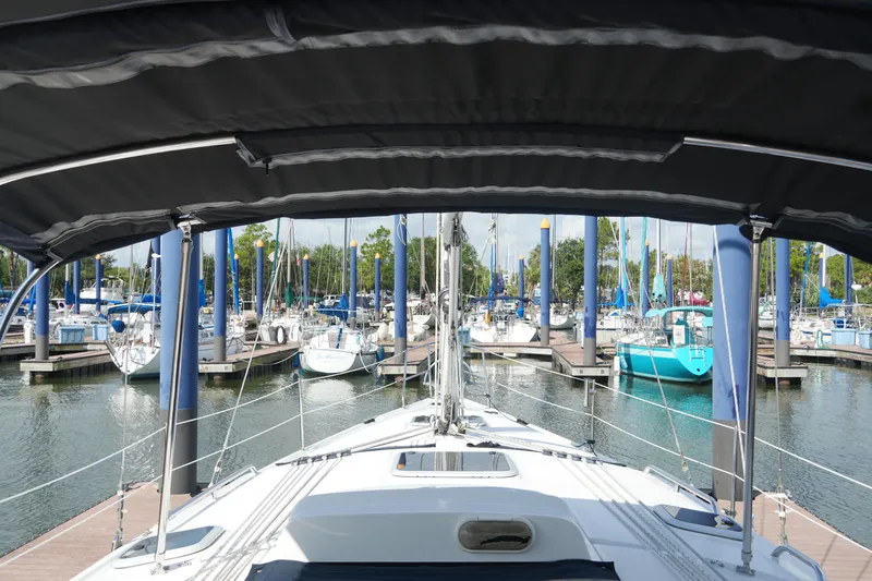 Marabelle Yacht Photos Pics Hunter 41 AC sailboat, 2005 model, docked in a marina with multiple boats.