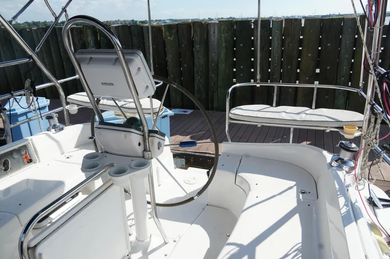 Marabelle Yacht Photos Pics Cockpit of 2005 Hunter 41 AC sailboat with steering wheel and seating area.