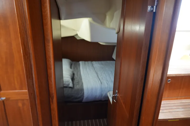Marabelle Yacht Photos Pics Cozy cabin interior of 2005 Hunter 41 AC sailboat with wooden finish.